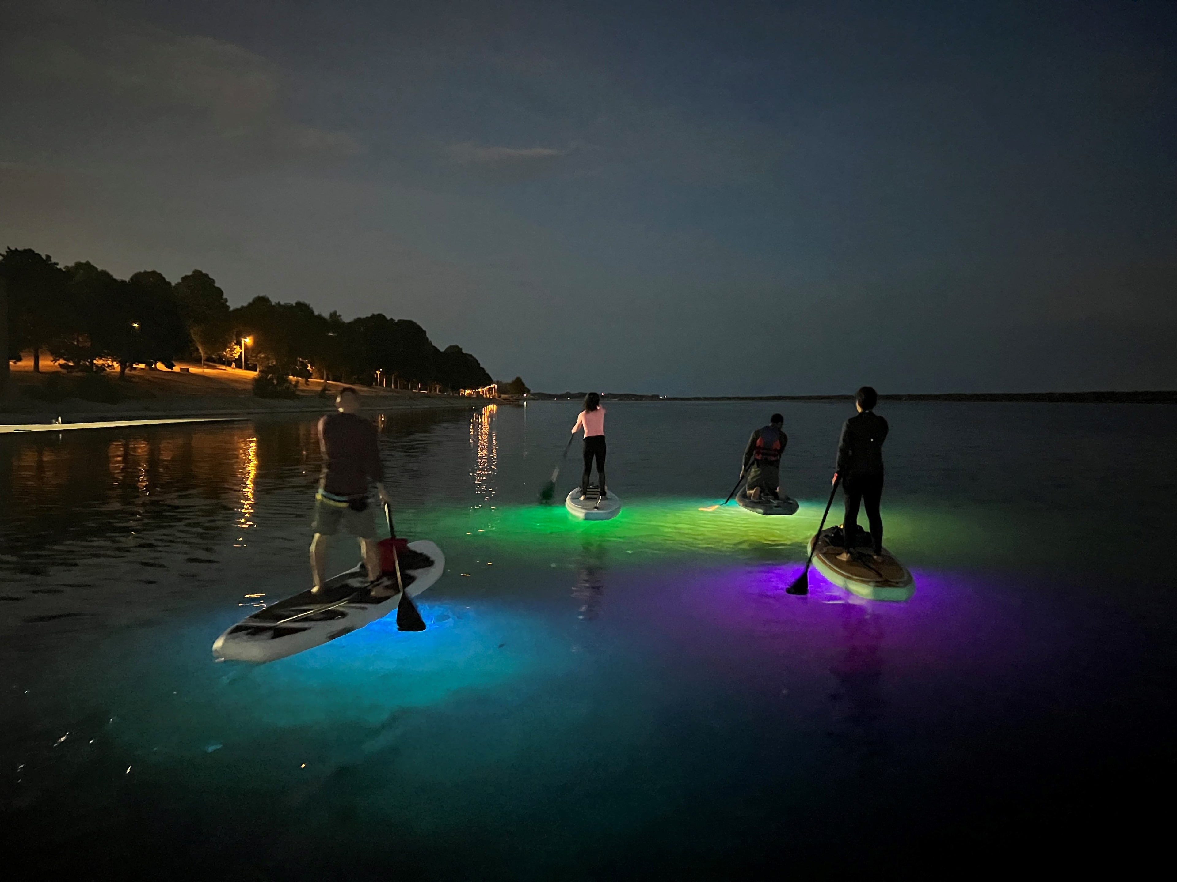 Night paddle boarding with the Aurora Explorer. The paddleboard lighting accessory for night paddles and also compatible with kayaks..