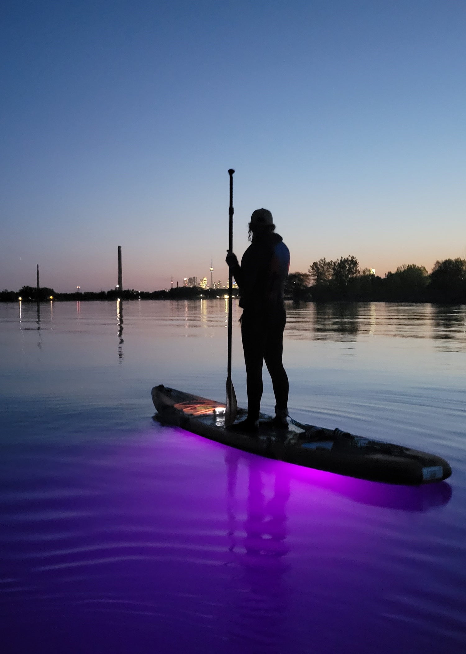 The Aurora Explorer illuminates the water below the paddleboard
