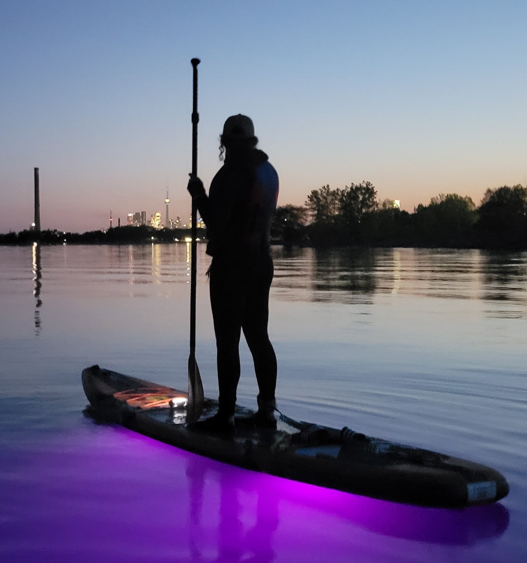 Aurora Explorer under a paddleboard at sunset